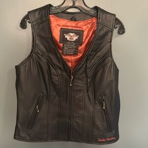 Harley Davidson women’s classic wing black leather vest. Excellent condition.